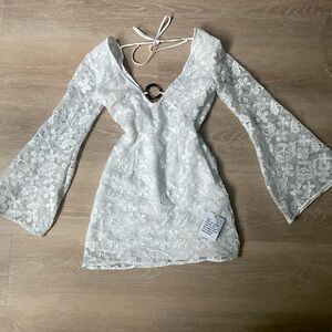 Flared sleeve crochet mini dress with ring detail